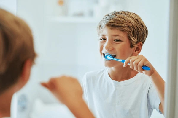 boy-child-reflection-toothbrush-bathroom-600nw-2485614241.webp